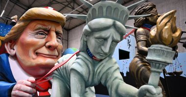 A carnival float, depicting U.S. President Donald Trump holding the Statue of Liberty and Lady Justice on a leash, is presented ahead of the traditional Rose Monday Carnival parade in Cologne, Germany, Feb. 25, 2025. (Reuters Photo)