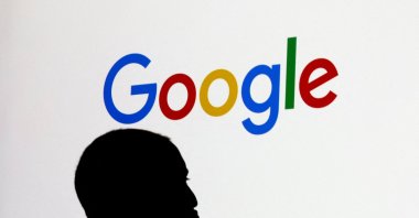 A man stands in front of a Google logo during a media reception at the Google France headquarters ahead of the Artificial Intelligence Action Summit, Paris, France, Feb. 9, 2025. (Reuters Photo)