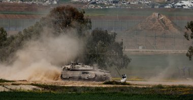 An Israeli tank manoeuvres on the Israeli side of the border between Israel and Gaza, March 18, 2025. (Reuters Photo)