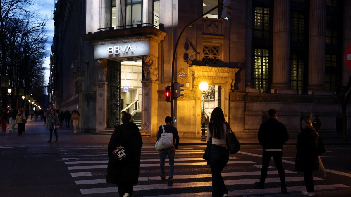 People walk past a branch of Spain's BBVA bank in Bilbao, Spain, March 10, 2025. (Reuters Photo)