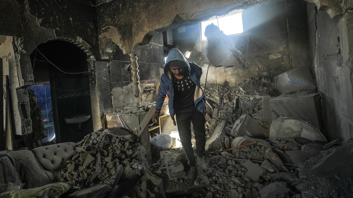 A Palestinian inspects a destroyed house belonging to the Hattab family following an Israeli airstrike in Gaza, Palestine, March 19, 2025. (EPA Photo)