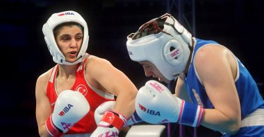 Turkish boxer Busenaz Sürmeneli (L) punches Serbia's Anastasija Lukajic during the World Championships, Nish, Serbia, March 14, 2025. (AA Photo).