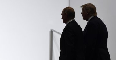 U.S. President Donald Trump (R) and Russian President Vladimir Putin walk to participate in a group photo at the G-20 summit, Osaka, Japan, June 28, 2019. (AP Photo)