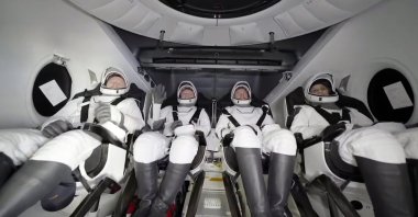 This image taken from a video released by SpaceX shows, from left, NASA&#039;s Butch Wilmore, Russia’s Alexander Gorbunov, NASA’s Nick Hague and NASA&#039;s Suni Williams waiting to exit the SpaceX capsule after splashing down, March 18, 2025. (AP Photo)