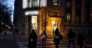 People walk past a branch of Spain's BBVA bank in Bilbao, Spain, March 10, 2025. (Reuters Photo)