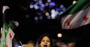 A child reacts during a demonstration marking the 14th anniversary of the start of the Syrian conflict, Damascus, Syria, March 15, 2025. (Reuters Photo)