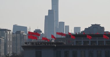 Flags fly on the National Museum of China near buildings in the central business district as seen from the Great Hall of the People in Beijing, China, March 6, 2025. (AFP Photo)