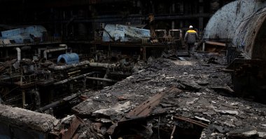 An employee walks at a thermal power plant damaged by multiple Russian missile strikes, in an undisclosed location in Ukraine, March 17, 2025. (Reuters Photo)