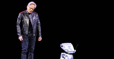 Nvidia CEO Jensen Huang talks to a robot during a keynote session at the SAP Center, San Jose, California, U.S., March 18, 2025. (AFP Photo)