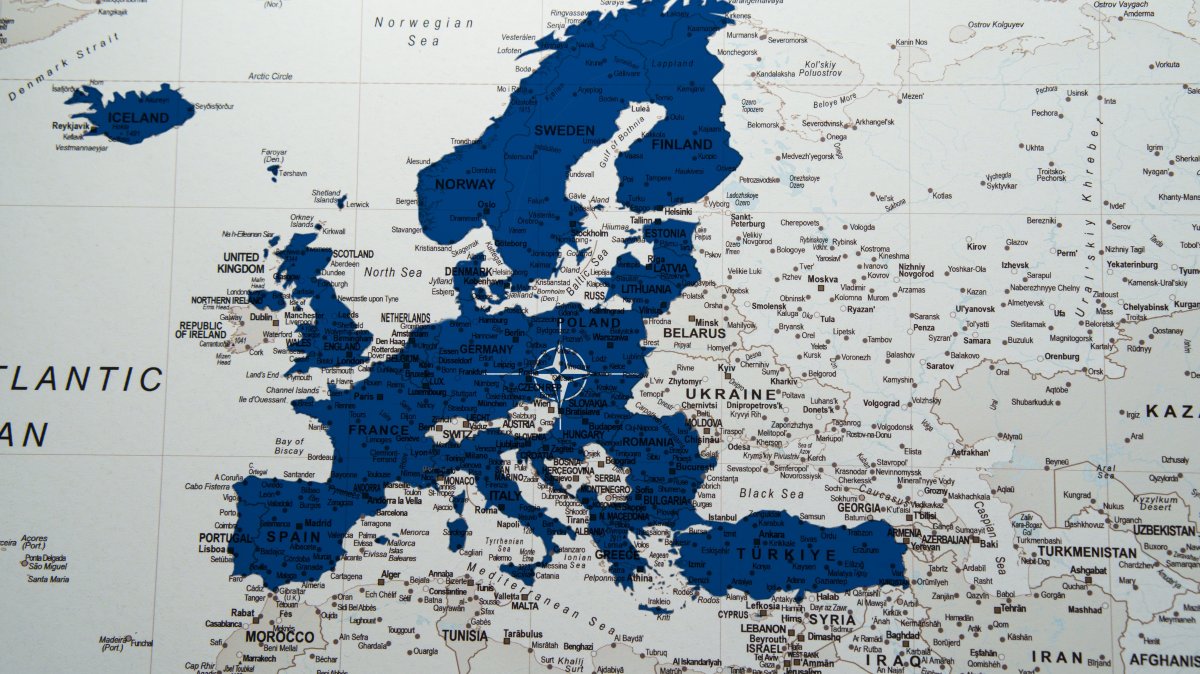 A NATO alliance flag on a European map. (Shutterstock Photo)