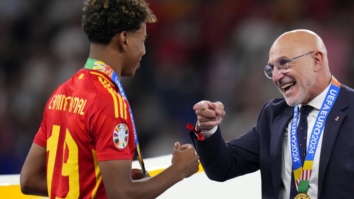 Spain's head coach Luis de la Fuente gestures to Lamine Yamal after winning the Euro 2024 final against England, in Berlin, Germany, July 14, 2024. (AP Photo)