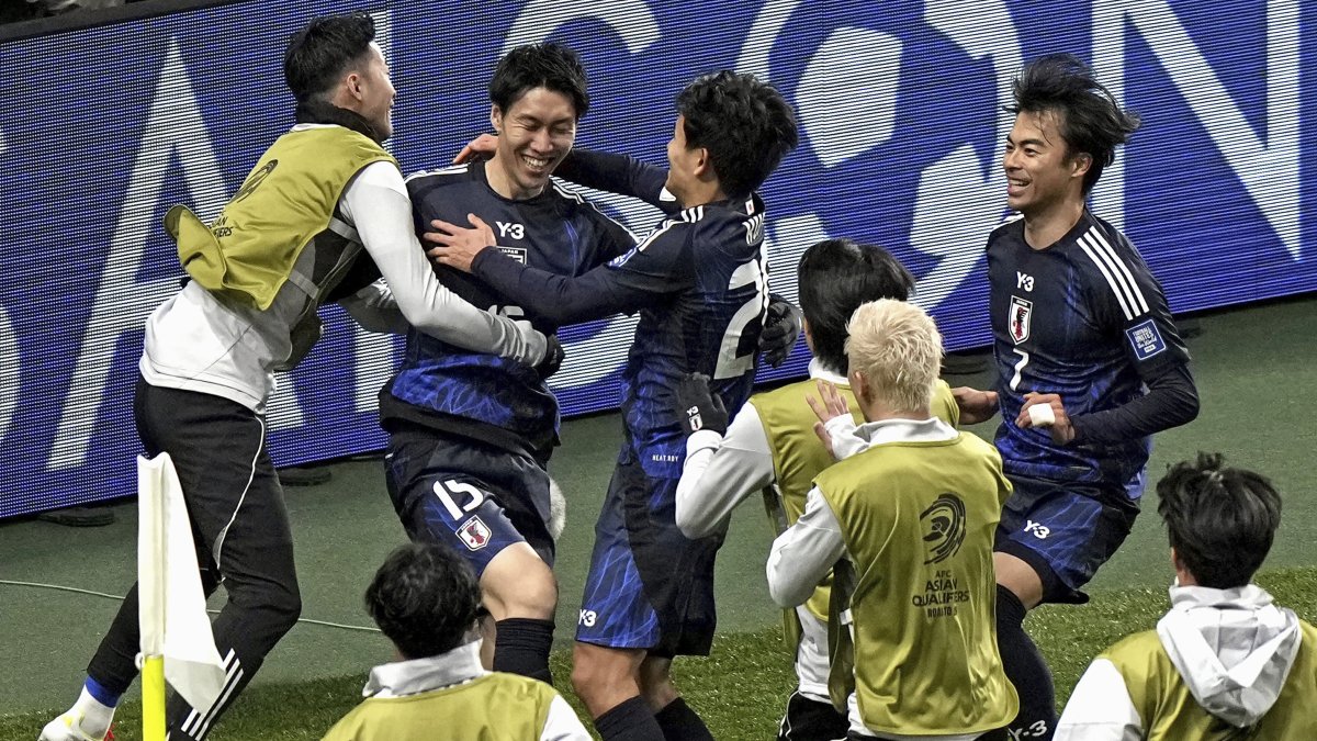Japan players celebrate scoring in a World Cup qualifying match against Bahrain at Saitama Stadium in Saitama, Japan, March 20, 2025. (AP Photo)