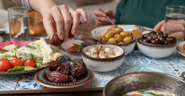To protect the stomach from sudden strain, it is recommended to break the fast with dates, followed by warm water and a light, low-fat soup. (Shutterstock Photo)