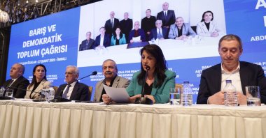 The Peoples&#039; Equality and Democracy Party (DEM Party) delegation shows a photo of themselves with PKK leader Abdullah Öcalan (screen C) as they address a news conference, Istanbul, Türkiye, Feb. 27, 2025. (EPA Photo)