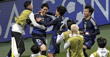 Japan players celebrate scoring in a World Cup qualifying match against Bahrain at Saitama Stadium in Saitama, Japan, March 20, 2025. (AP Photo)
