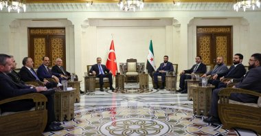 This handout picture released by the Turkish Foreign Ministry press service shows Türkiye’s Foreign Minister Hakan Fidan (C-L) meeting with Syria&#039;s interim President Ahmed al-Sharaa in Damascus, Syria, March 13, 2025. (AFP Photo)