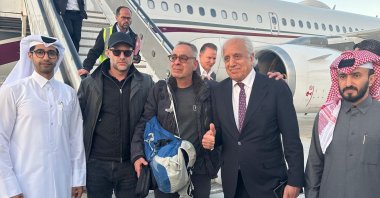 U.S. citizen George Glezmann (C) poses for a picture with U.S. official Adam Boehler (2nd L), former U.S. envoy to Afghanistan Zalmay Khalilzad (2nd R) and Qatari diplomats ahead of their departure to Doha, Kabul, Afghanistan, March 20, 2025. (AFP Photo)