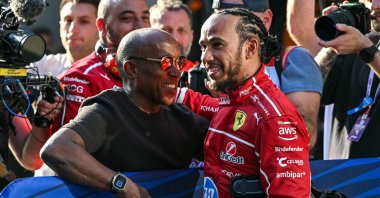 Ferrari&#039;s British driver Lewis Hamilton (R) celebrates taking pole position with his father Anthony Hamilton after the sprint qualifying session of the Formula One Chinese Grand Prix at the Shanghai International Circuit, Shanghai, China, March 21, 2025. (AFP Photo)