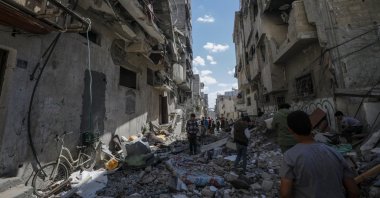 Palestinian civilians inspect a destroyed house belonging to the Hattab family following an Israeli airstrike, Gaza City, Palestine, March 19, 2025. (EPA Photo)