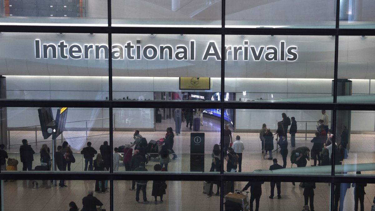 People wait near the international arrival area at Terminal 2 in Heathrow Airport in Hounslow, London, U.K., March 22, 2025. (EPA Photo)