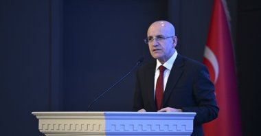 Treasury and Finance Minister Mehmet Şimşek delivers a speech at an event, Istanbul, Türkiye, Jan. 8, 2025. (AA Photo)