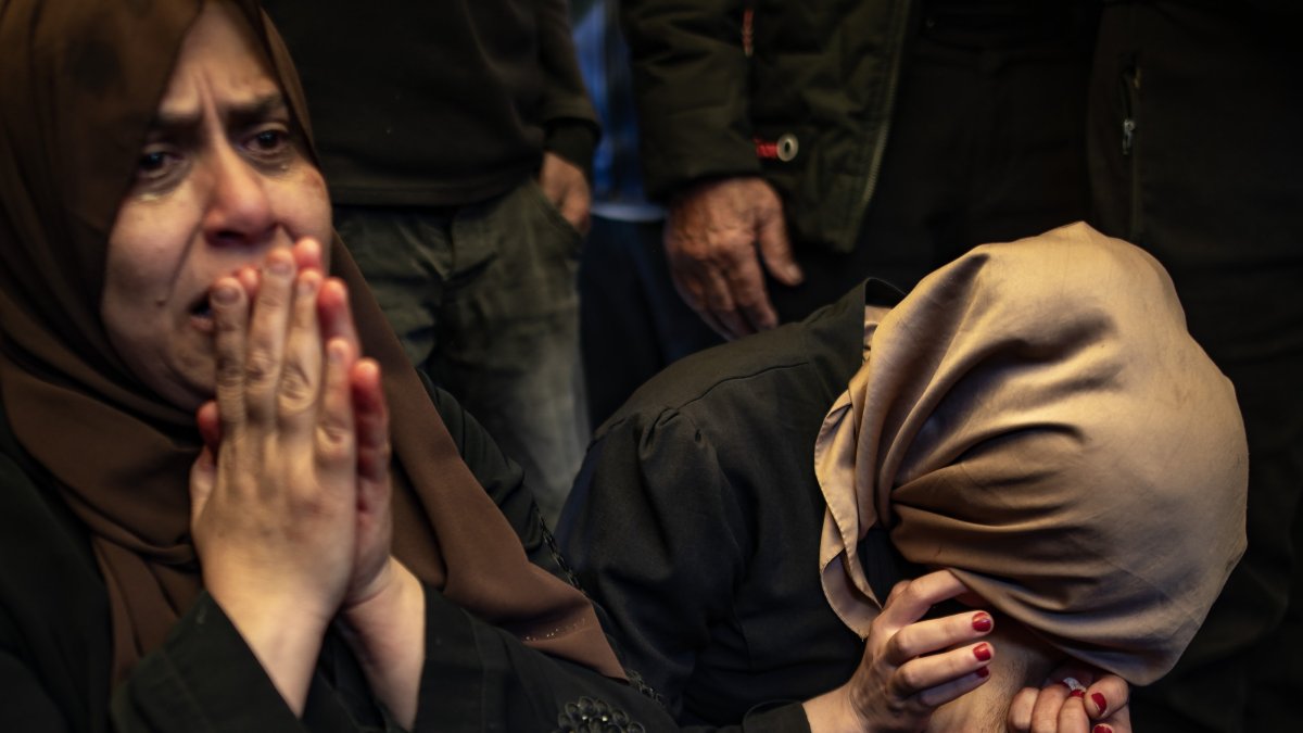 The mother (L) and the sister (R) of late journalist Mohammed Mansour mourn next to his body at the Nasser Hospital after he was killed in an Israeli airstrike on Khan Younis, Gaza Strip, Palestine, March 24, 2025. (EPA Photo)