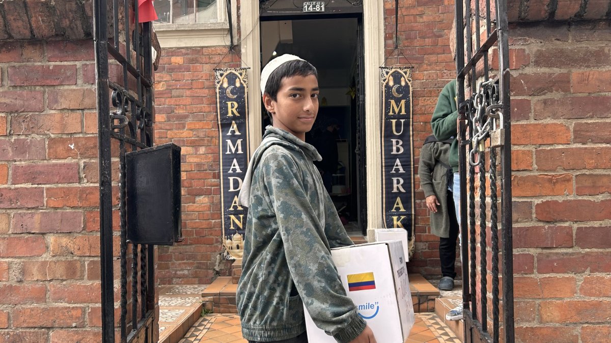 A Colombian teen poses during a food aid program organized by the Turkish Cooperation and Coordination Agency (TIKA), Bogota, Colombia, March 25, 2025. (AA Photo)