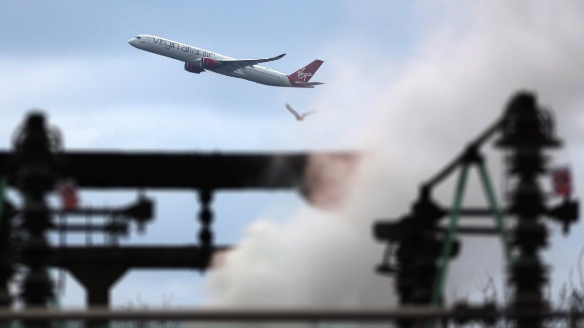 Smoke billows from the North Hyde Electricity Substation as an aircraft takes off from Heathrow Airport in Hayes, Britain, March 22, 2025. (EPA Photo)