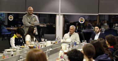 Fenerbahçe coach Jose Mourinho (C) speaks during an iftar dinner at Can Bartu Facilities, Istanbul, Türkiye, March 23, 2025. (IHA Photo)