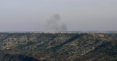 Smoke billows above Syrian teritory during Israeli bombardment, along the border Israel-annexed Golan Heights, March 25, 2025. (AFP Photo)