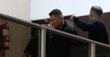 Late Argentine football legend Diego Maradona&#039;s former security Julio Coria (C) is escorted after being detained for false testimony at the San Isidro court, San Isidro, Buenos Aires, Argentina, March 25, 2025. (AFP Photo)