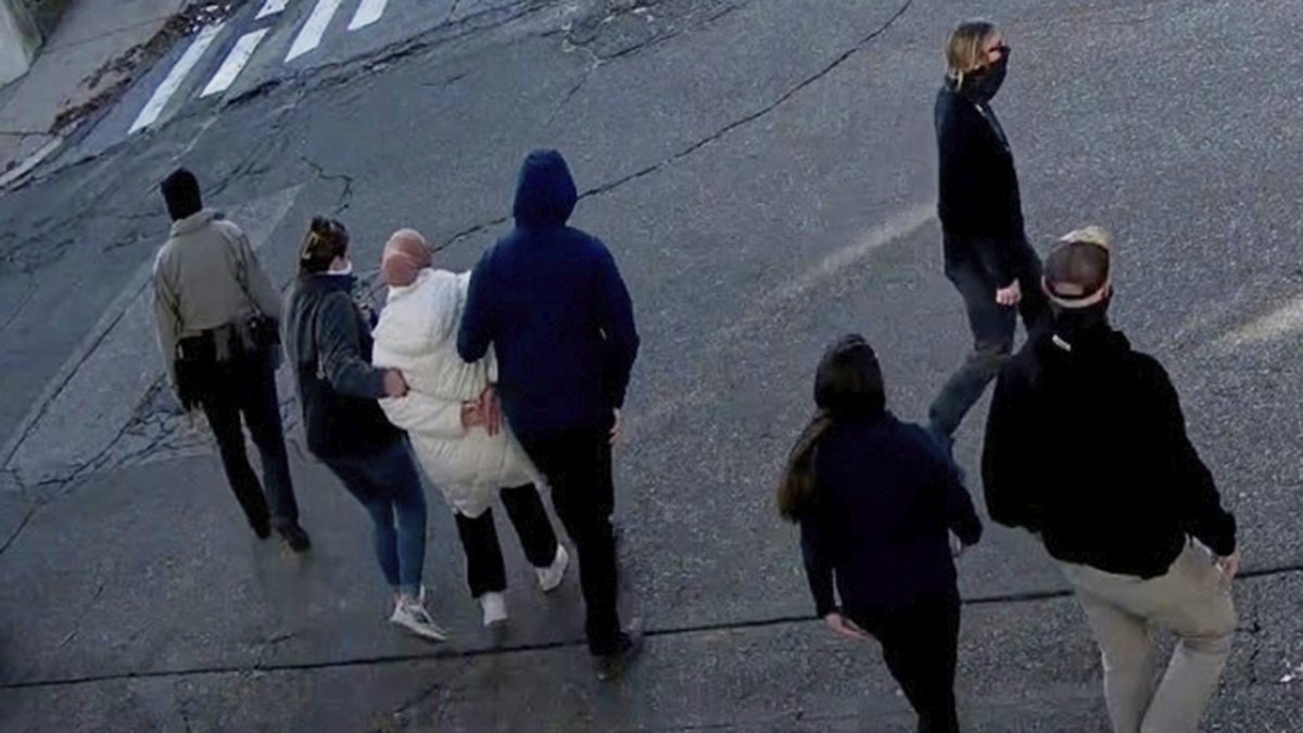 In this image taken from security camera video, Rümeysa Ozturk is detained by Department of Homeland Security agents, Somerville, Massachusetts, U.S., Mar. 26, 2025. (AP Photo)