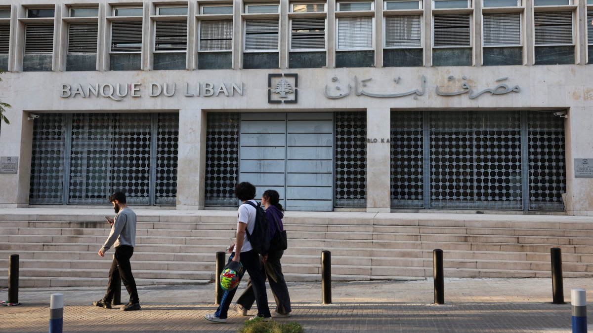 People walk past the central bank building in Beirut, Lebanon, March 27, 2025. (Reuters Photo)