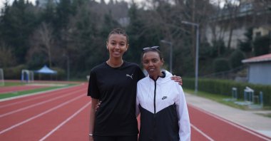 Turkish-Ethiopian athlete Elvan Abeylegesse (R) poses for a photo with her daughter Arsema Mulissa at the Enka Sports Club, Istanbul, Türkiye, March 26, 2025. (AA Photo)