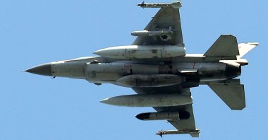 An Israeli fighter jet flies over the city of Yokneam Illit in northern Israel, March 24, 2025. (AFP Photo)