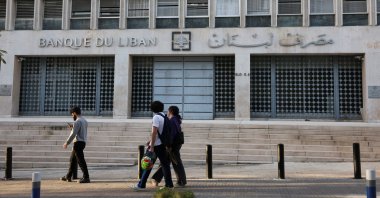 People walk past the central bank building in Beirut, Lebanon, March 27, 2025. (Reuters Photo)