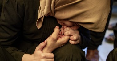 The sister of late journalist Mohammed Mansour mourns next to her brother&#039;s body at Al-Nasser Hospital after he was killed in an Israeli airstrike on Khan Younis, southern Gaza Strip, Palestine, March 24, 2025. (EPA Photo)
