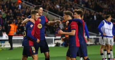 Barcelona players celebrate Robert Lewandowski&#039;s goal during the La Liga match against Osasuna at Estadi Olimpic Lluis Companys, Barcelona, Spain, March 27, 2025. (Reuters Photo)