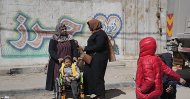 Yasmine al-Ghoufary (L) takes her niece Sila Abu Aqlan to the Artificial Limbs and Polio Center to learn how to walk with a prosthetic leg, Gaza City, Palestine, Feb. 26, 2025. (AP Photo)