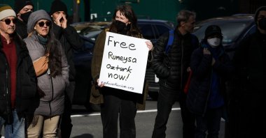 A resident holds a sign supporting Rümeysa Özturk during a protest at Harvard Square, Cambridge, Massachusetts, U.S., March 27, 2025. (EPA Photo)