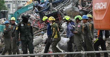 Rescue workers carry the body of a victim at the site of an under-construction building collapse two days after an earthquake struck central Myanmar and Thailand, Bangkok, Thailand, March 30, 2025. (AFP Photo)