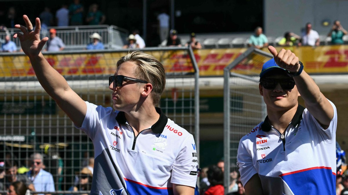 Red Bull&#039;s New Zealander driver Liam Lawson (L) and Japanese driver Yuki Tsunoda take part in the drivers&#039; parade before the start of the U.S. Grand Prix at the Circuit of the Americas, Austin, U.S., Oct. 20, 2024. (AFP Photo)