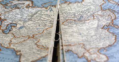 A stock photo of a torn atlas map of Eurasia (Getty Images Photo)