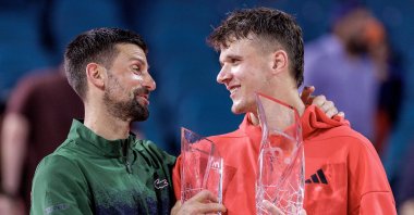 Czechia's Jakub Mensik (R) holds the champion's trophy while speaking with Serbia's Novak Djokovic, after Mensik won the Men's Singles Final at the 2025 Miami Open tennis tournament at the Hard Rock Stadium, Miami, U.S., March 30, 2025. (EPA Photo)