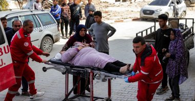 Paramedics transport an injured woman arriving at the Indonesian Hospital in Beit Lahia, Gaza Strip, Palestine, March 25, 2025. (AFP Photo)