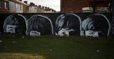 A mural of The Beatles is seen painted on the end of a row of terraced houses, Liverpool, U.K., Feb. 18, 2015. (Reuters File Photo)