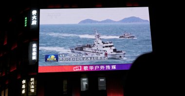 A China Coast Guard vessel is seen on a giant screen showing news footage about the coast guard's law enforcement patrols in waters around Taiwan, outside a shopping mall in Beijing, China, April 1, 2025. (Reuters Photo)