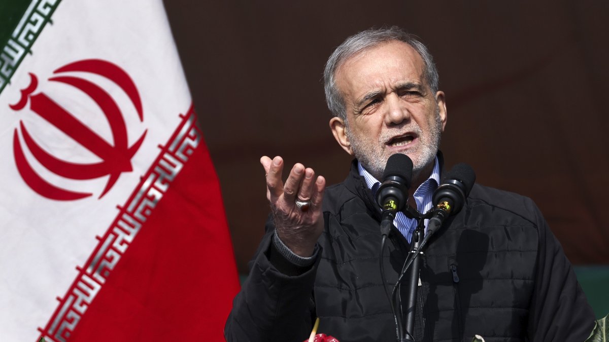 In this photo released by the Iranian Presidency Office, President Masoud Pezeshkian speaks during a rally commemorating the anniversary of the 1979 Islamic Revolution that toppled the late pro-U.S. Shah Mohammad Reza Pahlavi in Tehran, Iran, Monday, Feb. 10, 2025. (Iranian Presidency Office via AP)