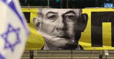 A portrait of Israel&#039;s Prime Minister Benjamin Netanyahu hangs on the sidewalk during an anti-government protest, in front of the Israeli Defence Ministry, Tel Aviv, Israel, March 29, 2025. (AFP Photo)