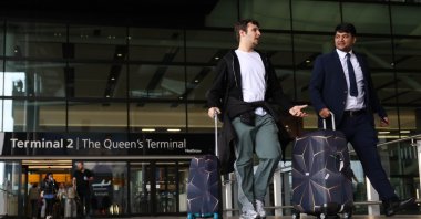 Passengers walk with their luggage at Terminal 2 arrivals at Heathrow Airport, Hounslow, Britain, March 22, 2025. (EPA Photo)